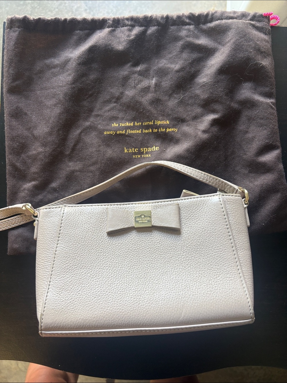 kate spade cream pebbled leather bow crossbody with gold-tone plaque